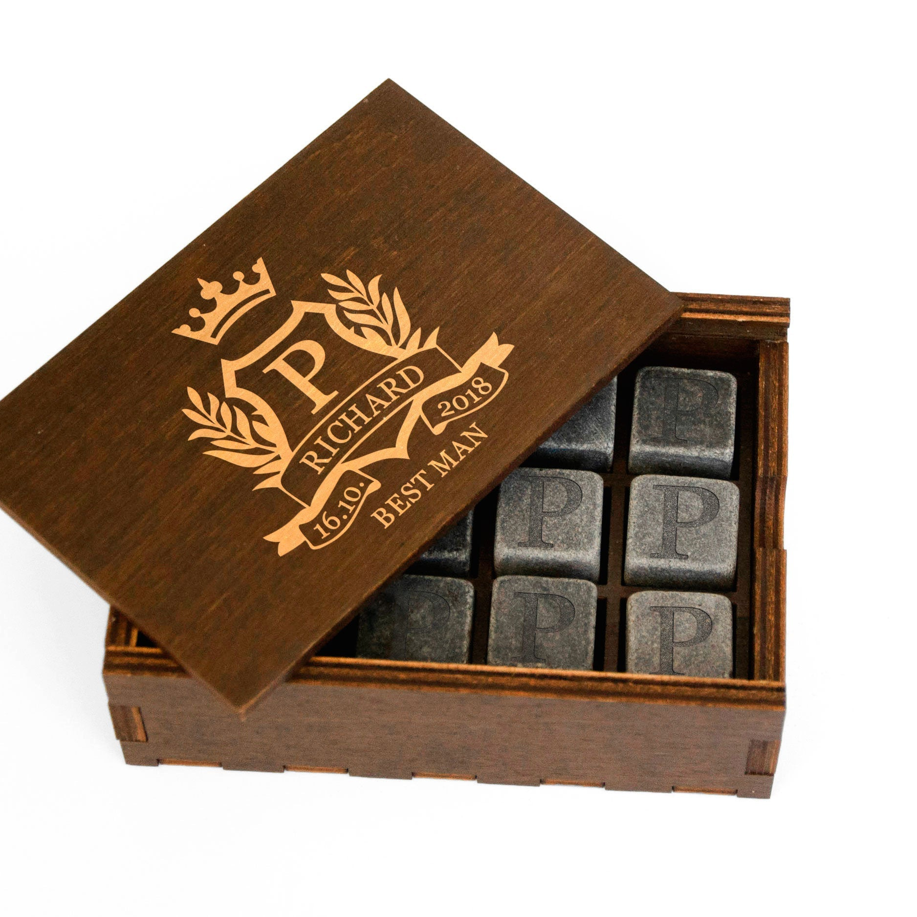 A wooden box containing six gray cubes with the letters "P" printed on them.