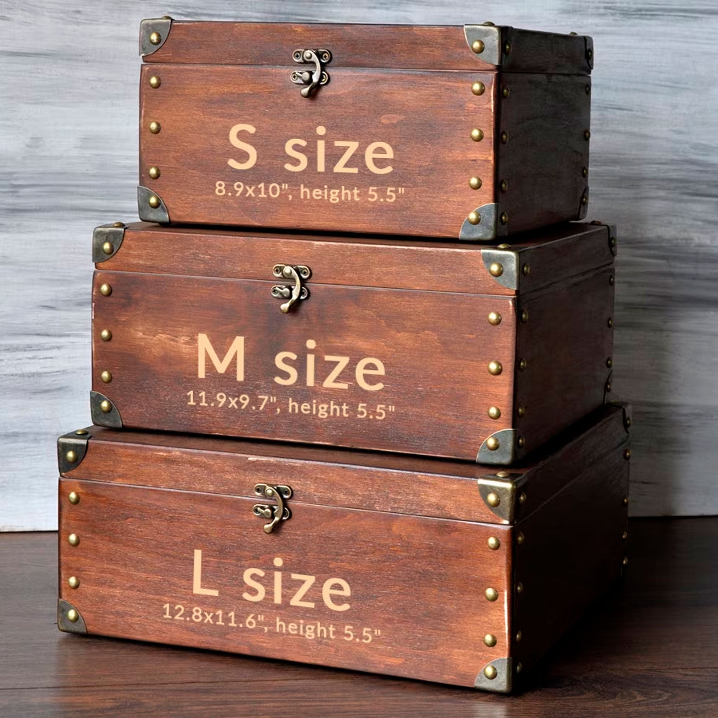 A set of three wooden trunks or chests, each with a different size indicated by the text. The largest chest is labeled "S size", the medium-sized one is labeled "M size", and the smallest one is labeled "L size".